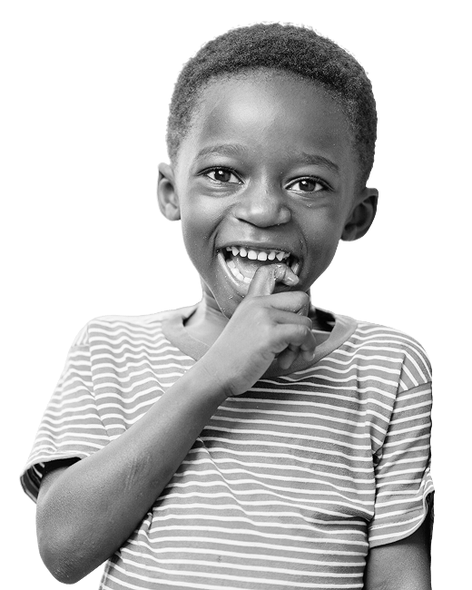 Smiling young boy in a striped t-shirt biting his finger playfully.